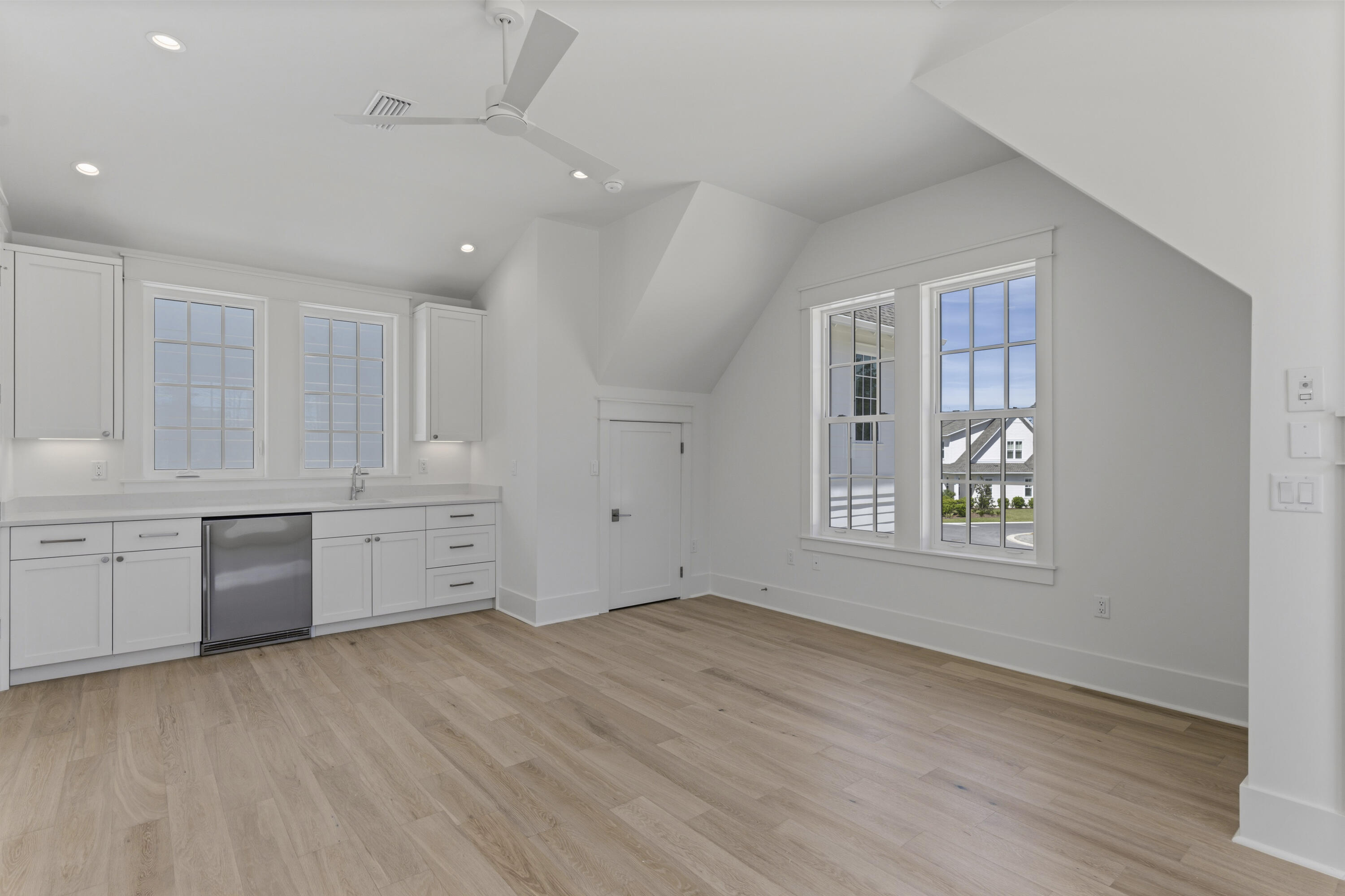 130 East Elliot Way Watersound, FL 32461 - Photo 46 of 52 a view of an empty room with window and wooden floor