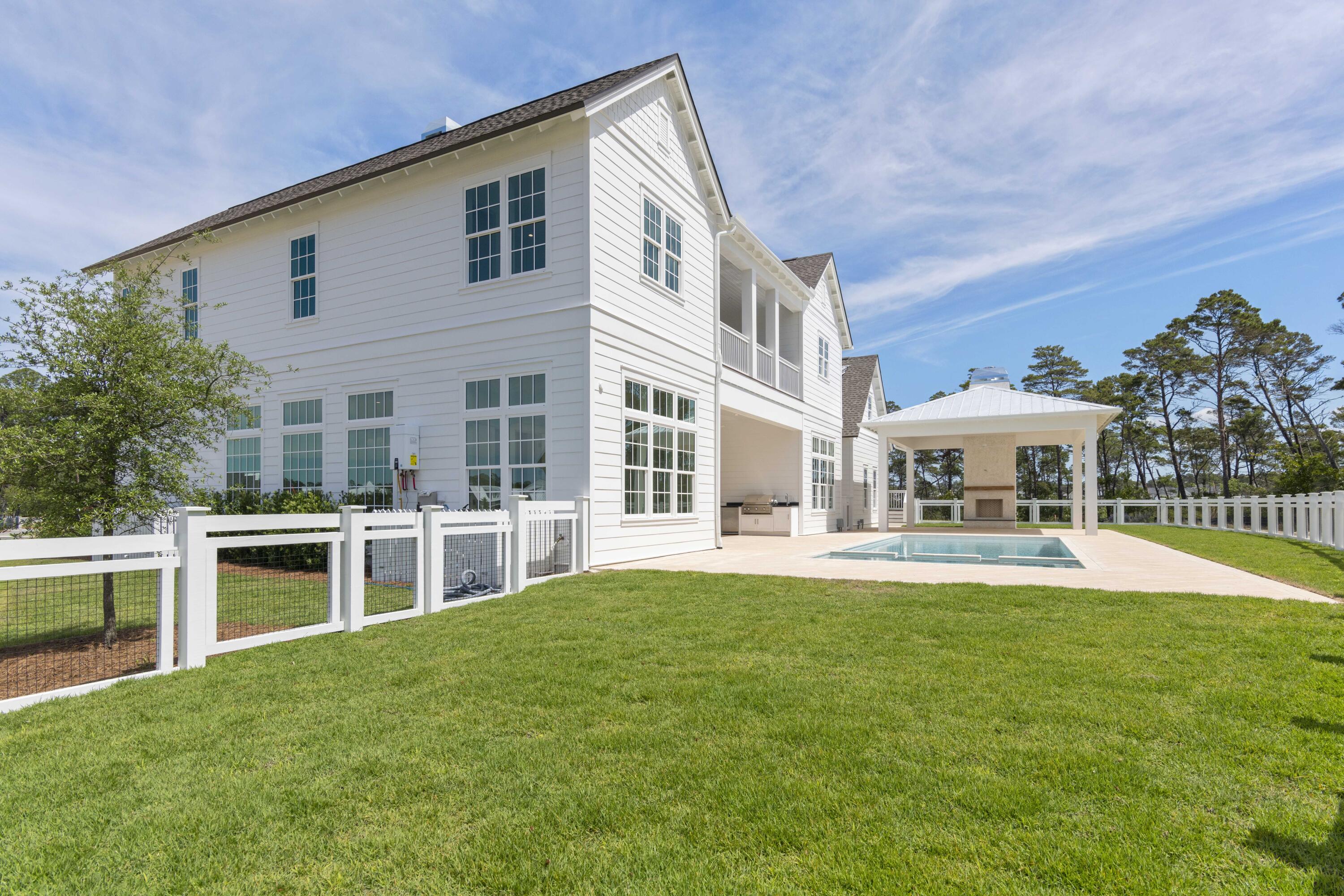 130 East Elliot Way Watersound, FL 32461 - Photo 50 of 52 a view of a house with a yard and sitting area