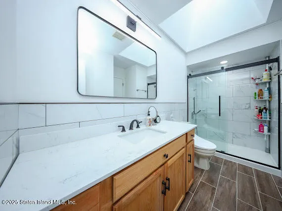 a bathroom with a sink and a mirror with bathtub
