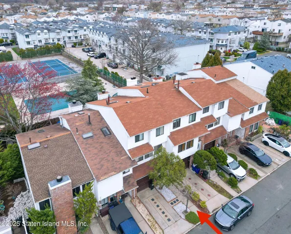 an aerial view of residential houses with outdoor space