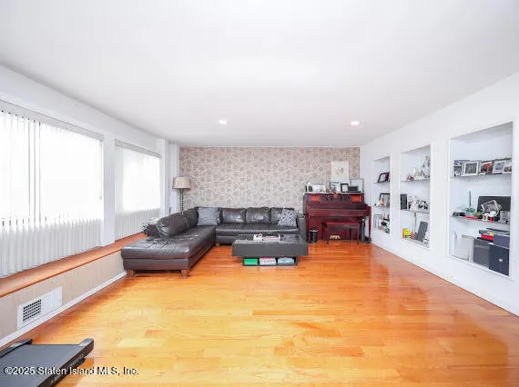 a living room with furniture and a table
