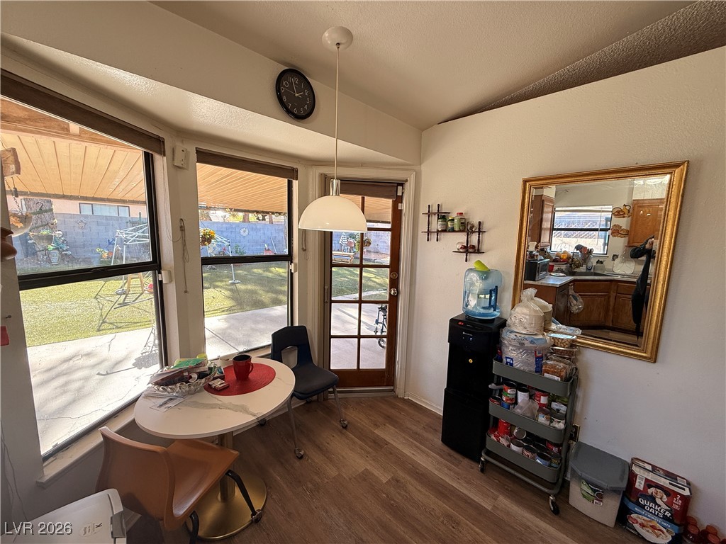 6425 West Eagle Point Road Las Vegas, NV 89108 - Photo 26 of 42 Dining room with lofted ceiling and dark wood finished floors
