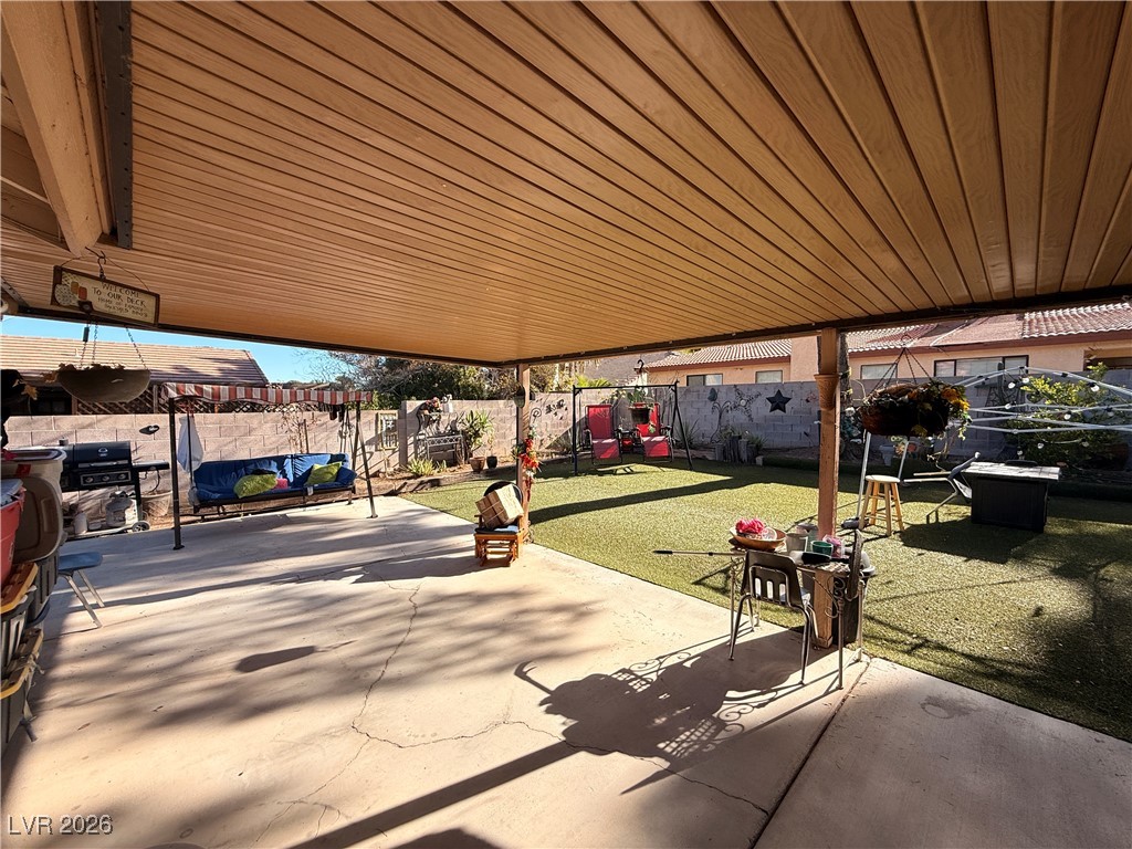 6425 West Eagle Point Road Las Vegas, NV 89108 - Photo 34 of 42 Fenced backyard with a patio and a playground