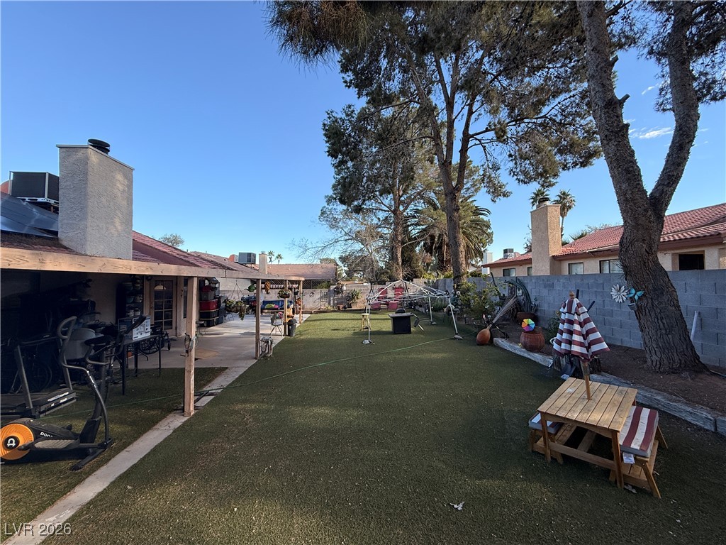 6425 West Eagle Point Road Las Vegas, NV 89108 - Photo 41 of 42 Fenced backyard with a patio area
