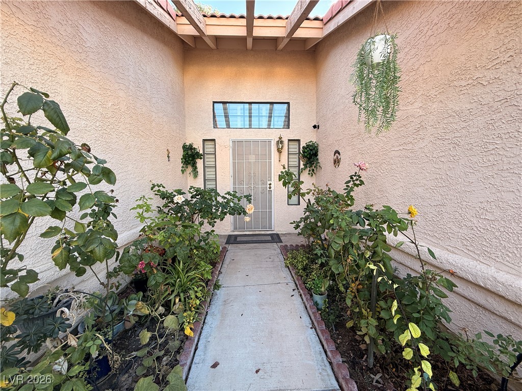 6425 West Eagle Point Road Las Vegas, NV 89108 - Photo 6 of 42 Entrance to property with stucco siding and a tile roof