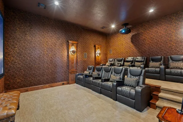 a kitchen with a dining table chairs stove and cabinets