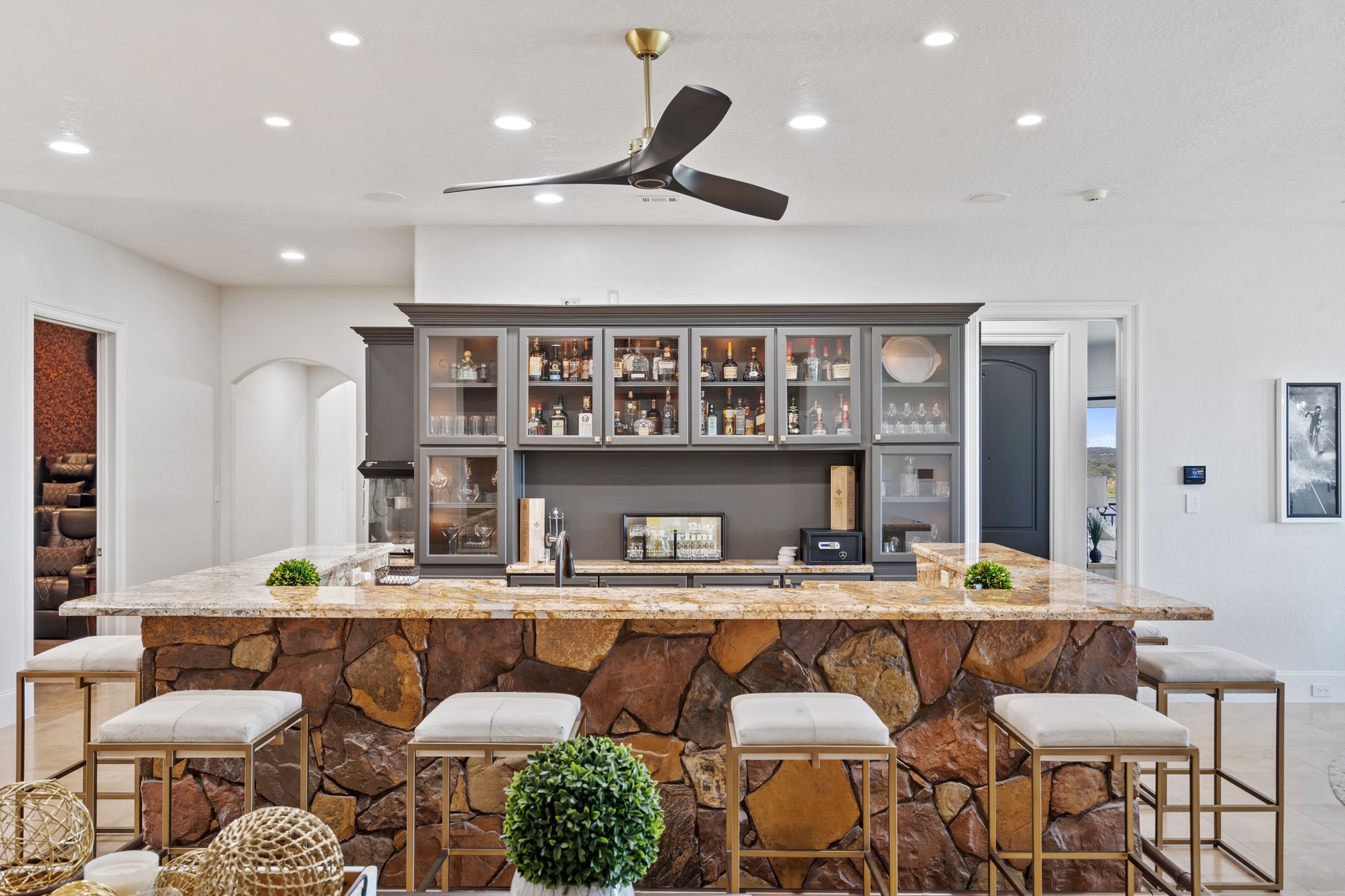 1216 Travis Bluff Way Spicewood, TX 78669 - Photo 22 of 38 a kitchen with a dining table chairs stove and cabinets