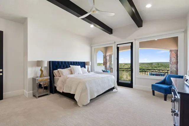 a view of a chair and tables in the balcony