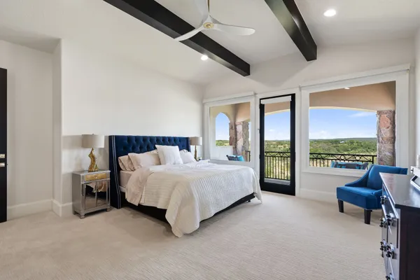 a view of a chair and tables in the balcony