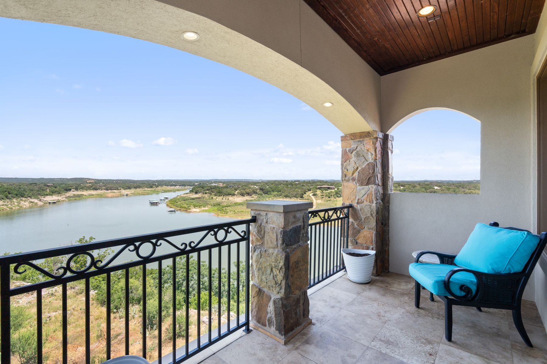 1216 Travis Bluff Way Spicewood, TX 78669 - Photo 25 of 38 a view of a chair and tables in the balcony