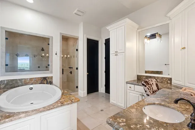 a bedroom with two beds and a window