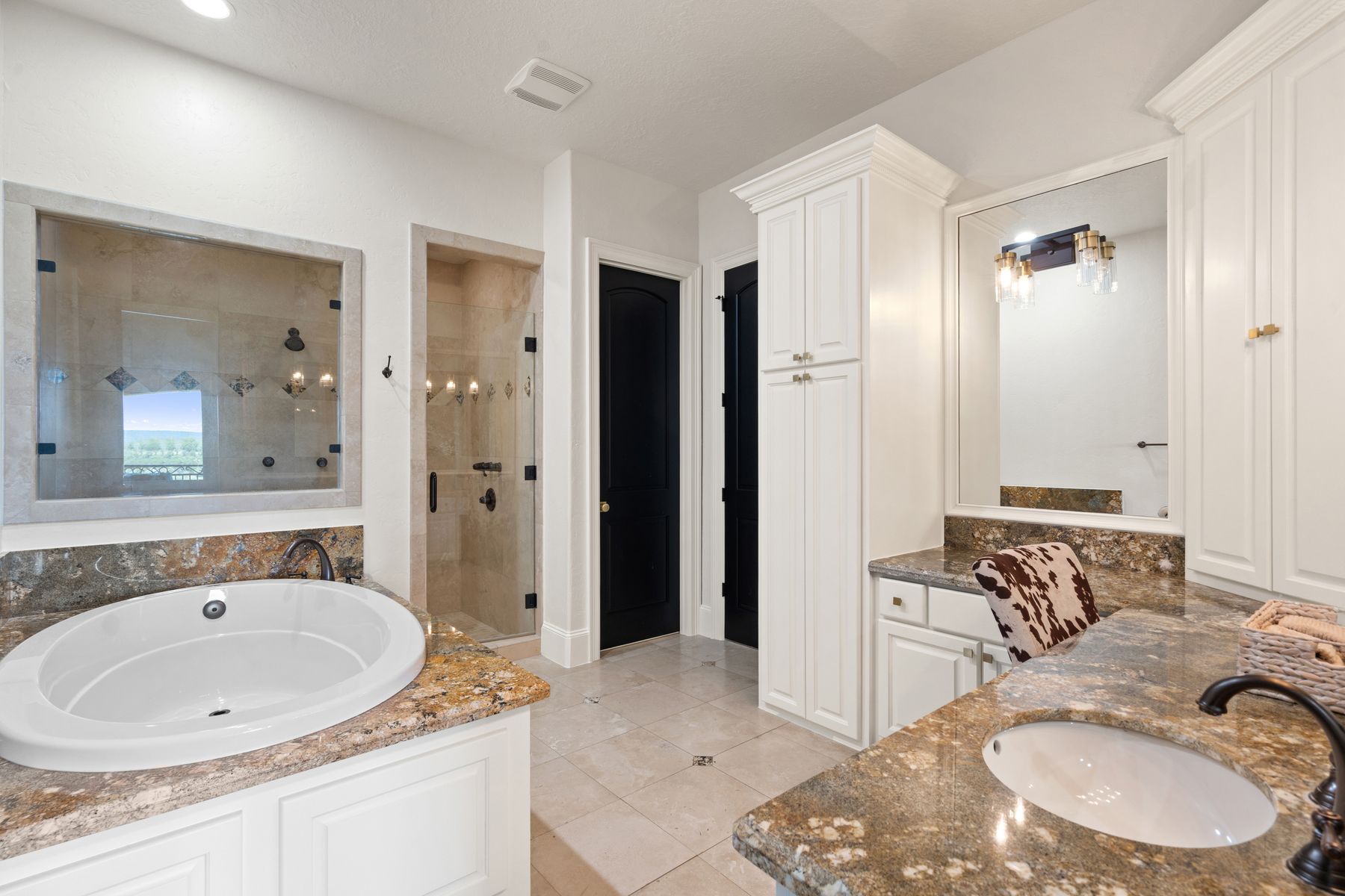 1216 Travis Bluff Way Spicewood, TX 78669 - Photo 26 of 38 a bathroom with a sink and a mirror