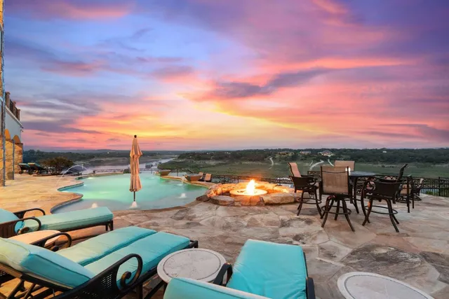 a kitchen with stainless steel appliances granite countertop a sink and a wooden cabinets