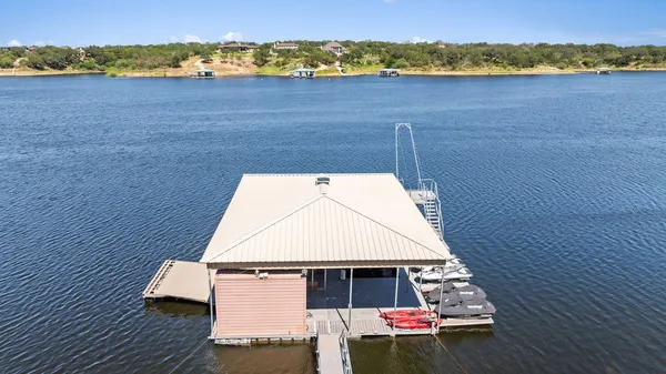 an aerial view of a house with a yard