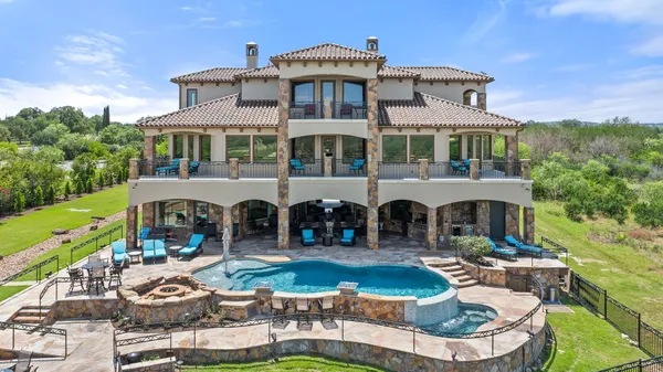 a view of swimming pool with a patio