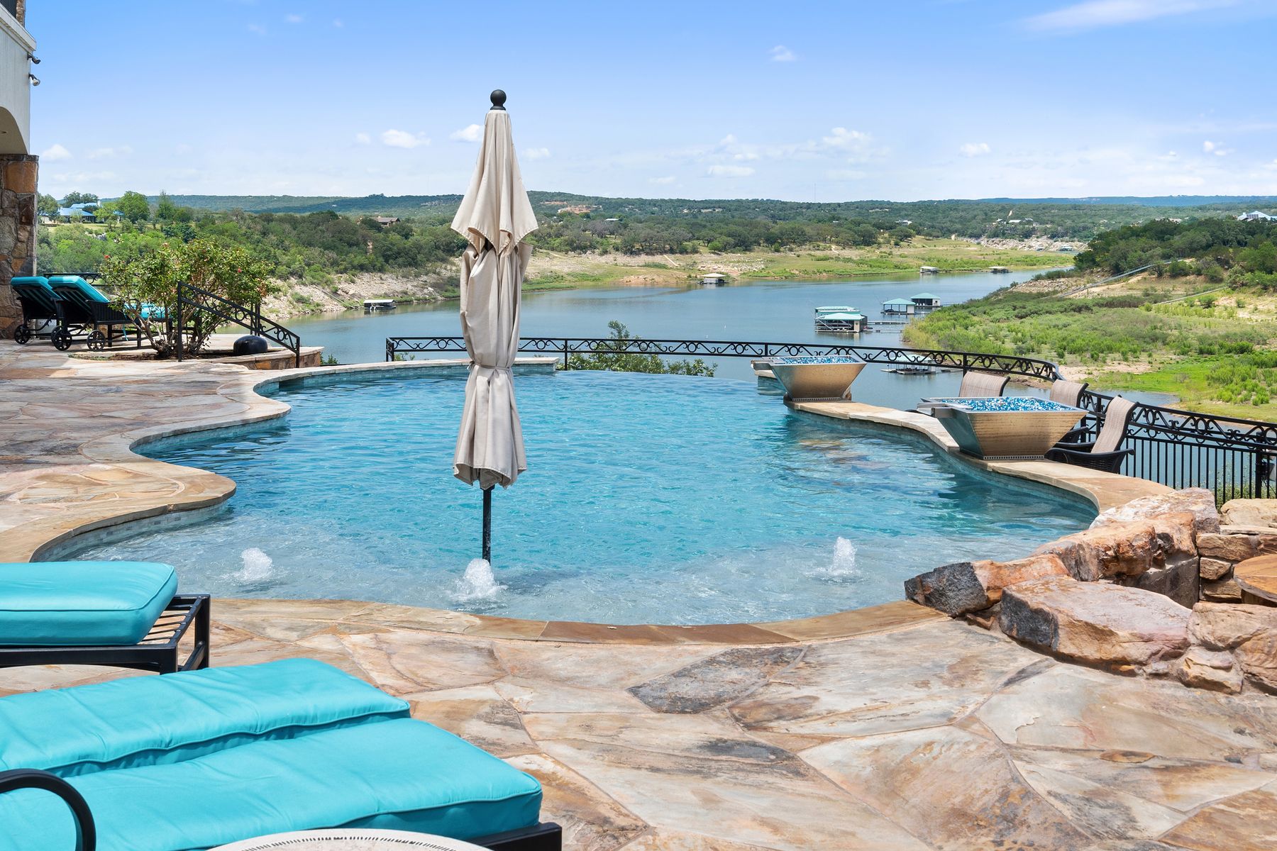 1216 Travis Bluff Way Spicewood, TX 78669 - Photo 7 of 38 a view of swimming pool with a patio