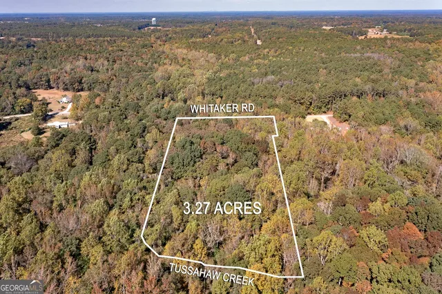 an aerial view of residential building with ocean view