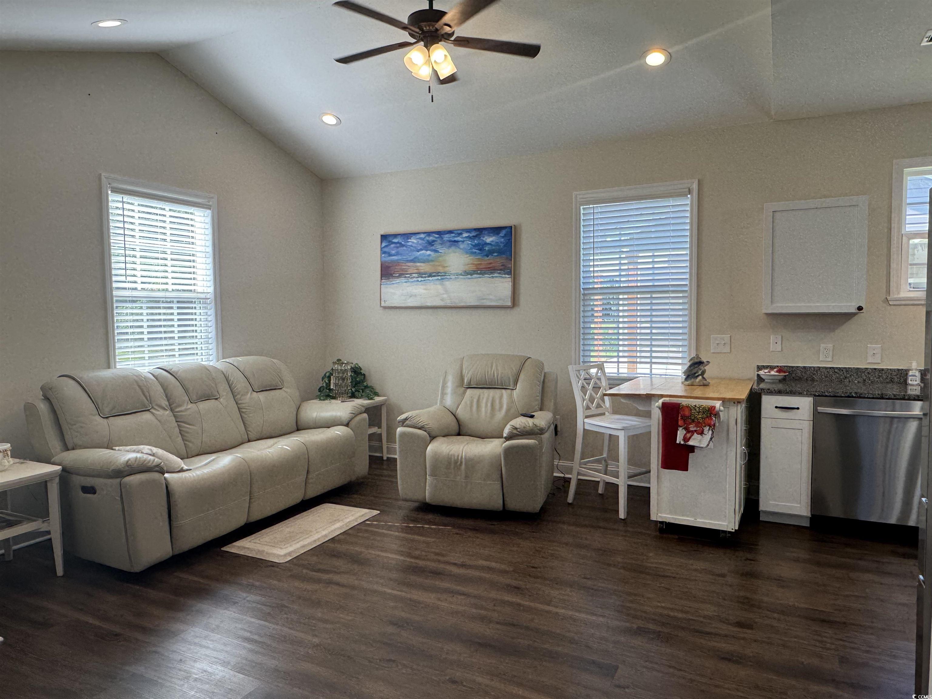 304 South Magnolia Avenue Andrews, SC 29510 - Photo 7 of 19 Living area featuring lofted ceiling, plenty of natural light, a ceiling fan, dark wood-style flooring, and recessed lighting