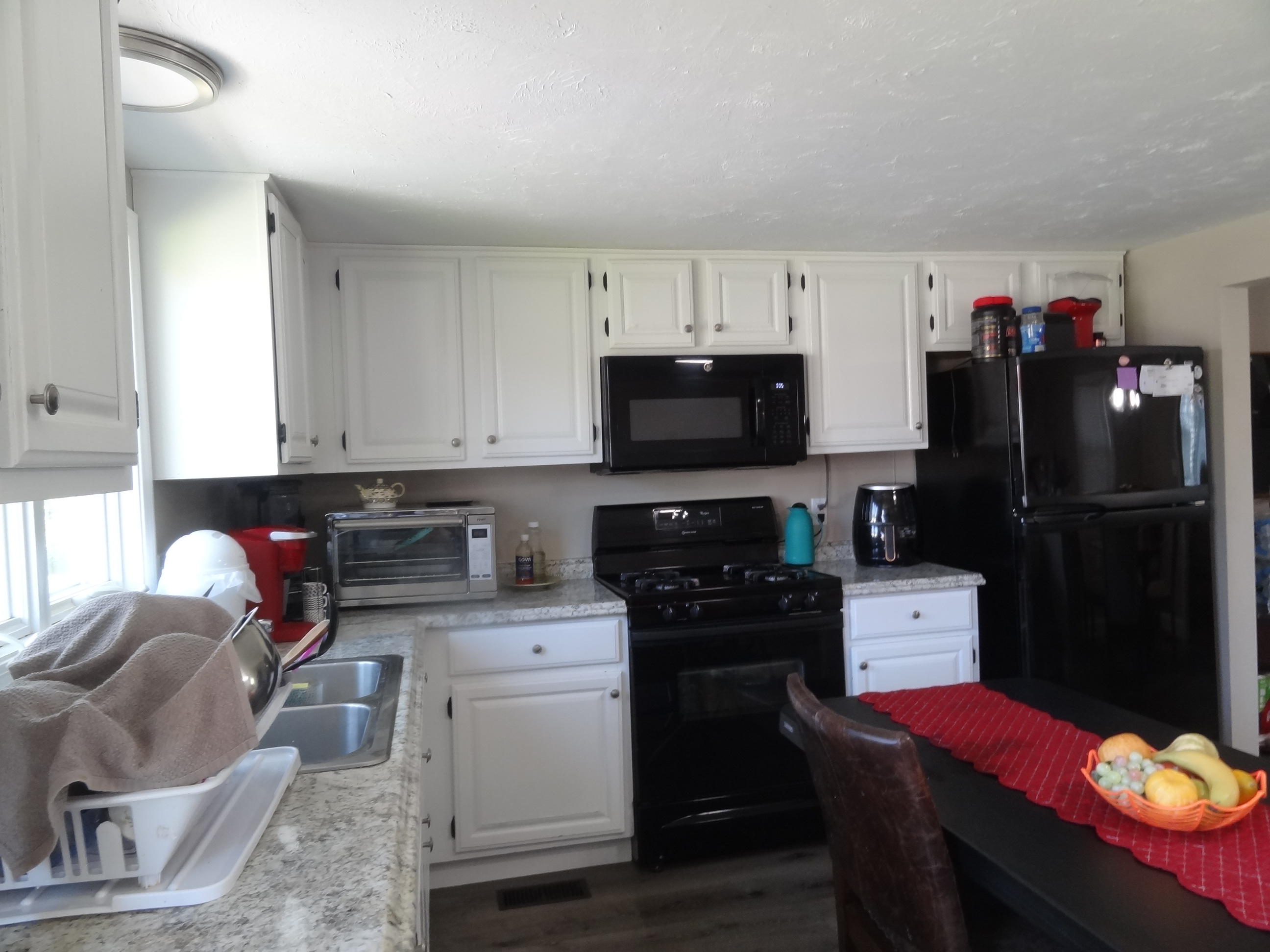 19 Brookshire Road Hyannis, MA 02601 - Photo 8 of 28 a kitchen with a sink stainless steel appliances and cabinets