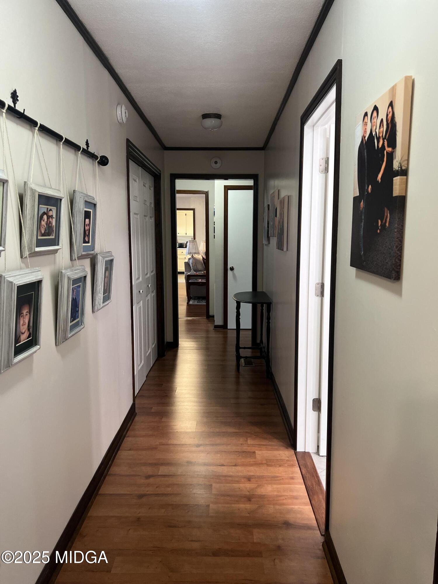 311 Overlook Drive Montezuma, GA 31063 - Photo 22 of 25 a view of a hallway with wooden floor and windows