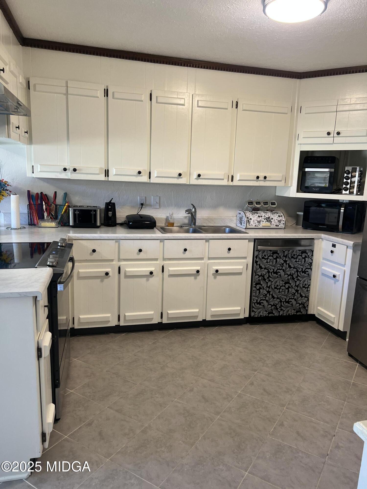 311 Overlook Drive Montezuma, GA 31063 - Photo 3 of 25 a large kitchen with cabinets