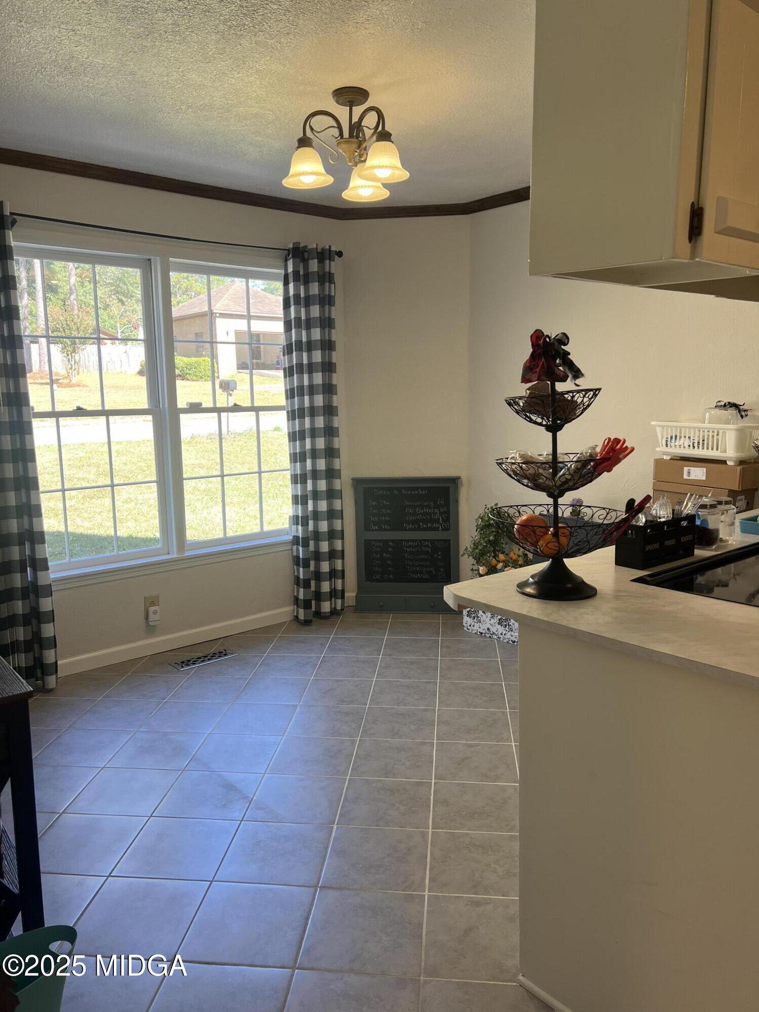 311 Overlook Drive Montezuma, GA 31063 - Photo 6 of 25 a kitchen with a sink a stove and cabinets