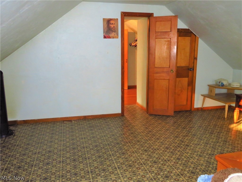 9499 Avon Belden Road North Ridgeville, OH 44039 - Photo 20 of 31 Another view of the larger bedroom upstairs. There is hardwood under the linoleum, a closet, and a walk in storage area