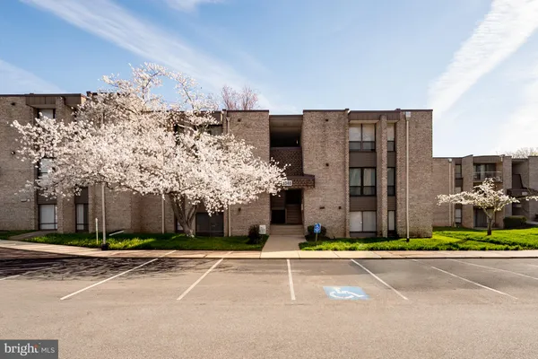 a view of a building with a small yard