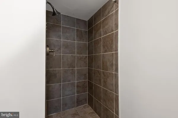 a bathroom with a sink vanity and a mirror
