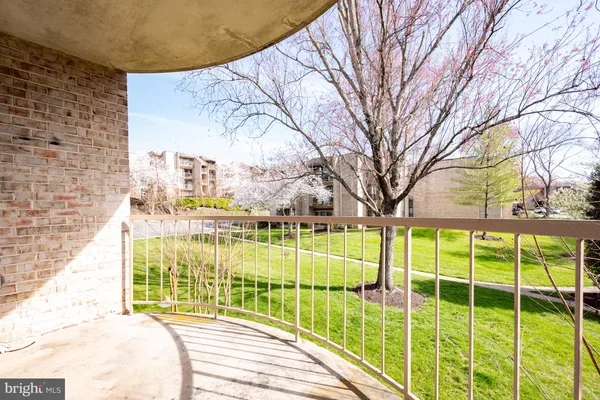 a bathroom with a shower and a mirror