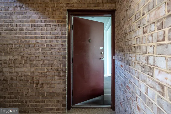 a front view of a building with a yard