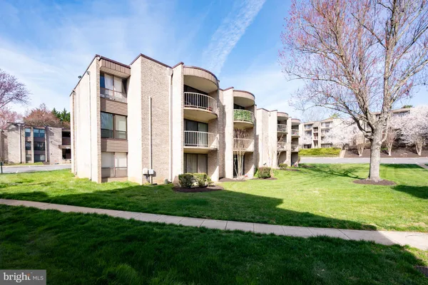 front view of a building with a yard