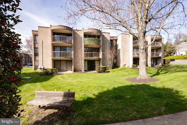 a large building with trees in front of it