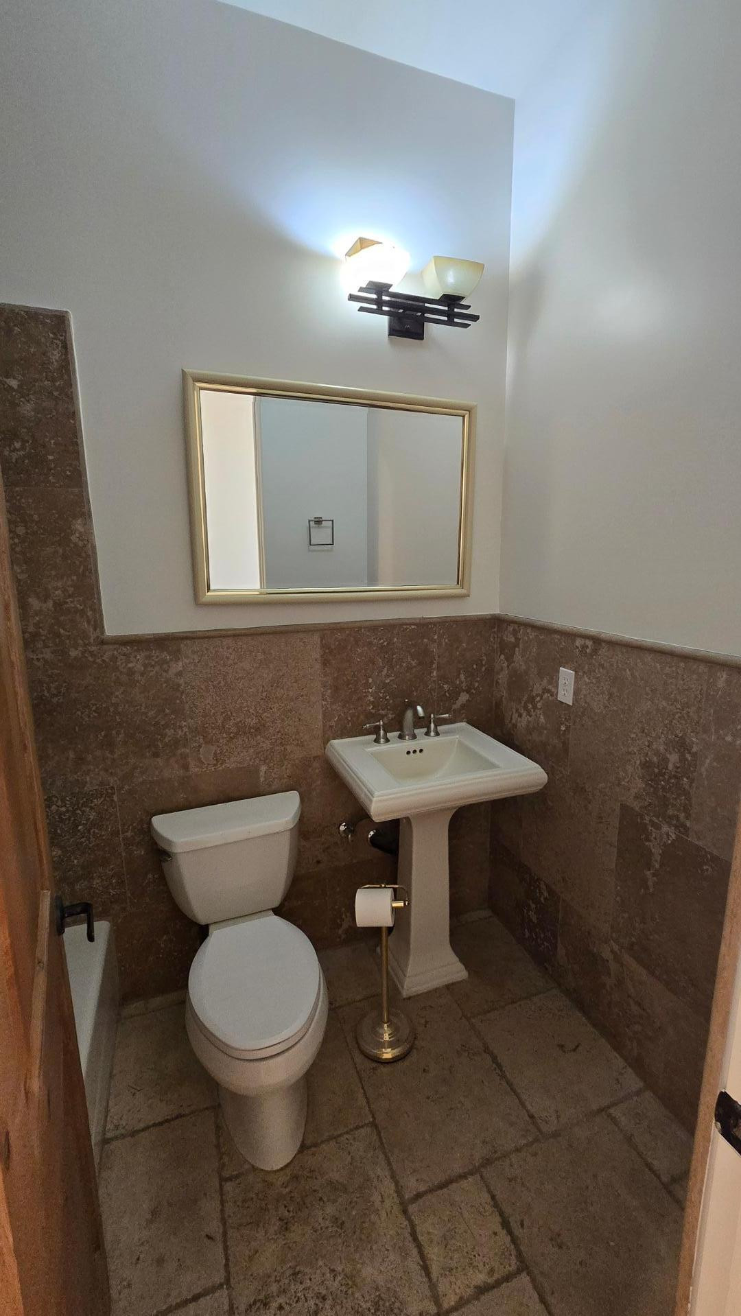 4485 East Quail Brush Road Cave Creek, AZ 85331 - Photo 11 of 64 a bathroom with a toilet sink and mirror