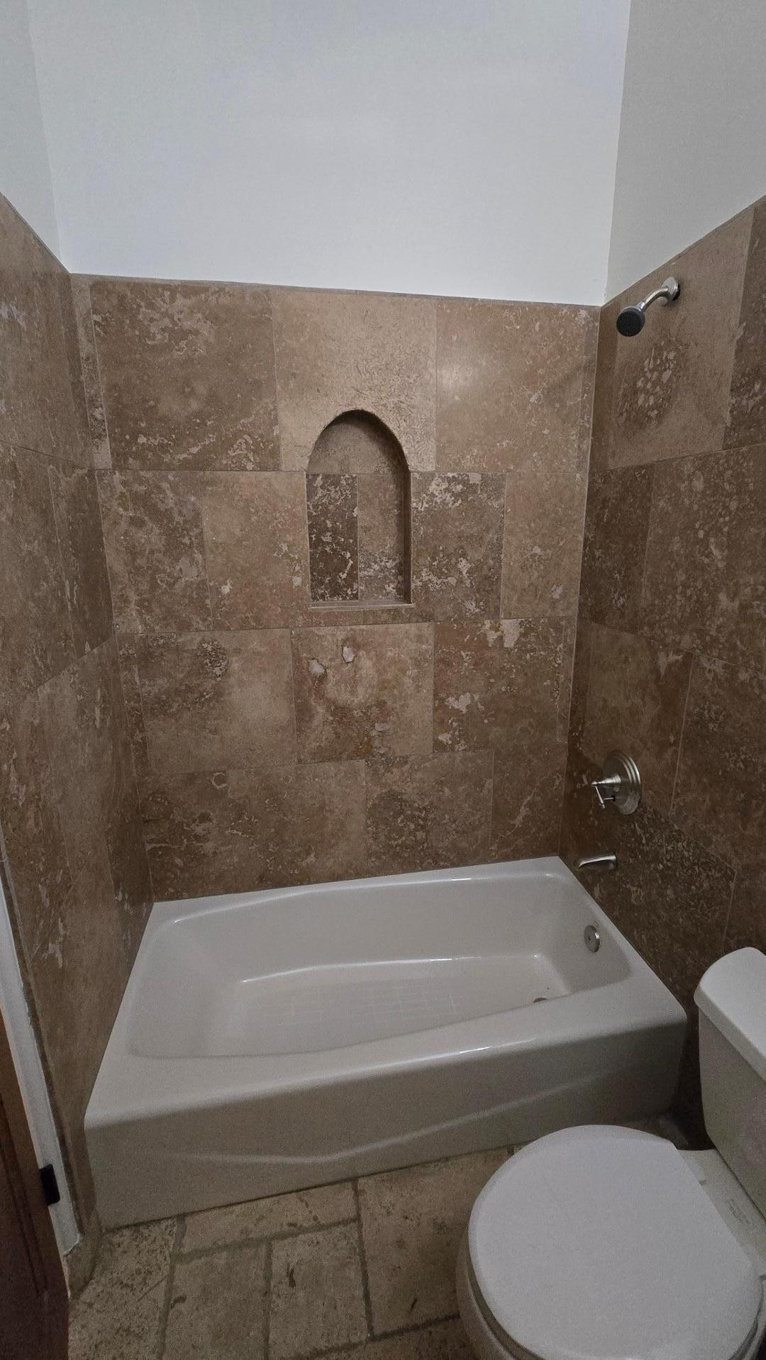 4485 East Quail Brush Road Cave Creek, AZ 85331 - Photo 12 of 64 a bathroom with a toilet and a bathtub