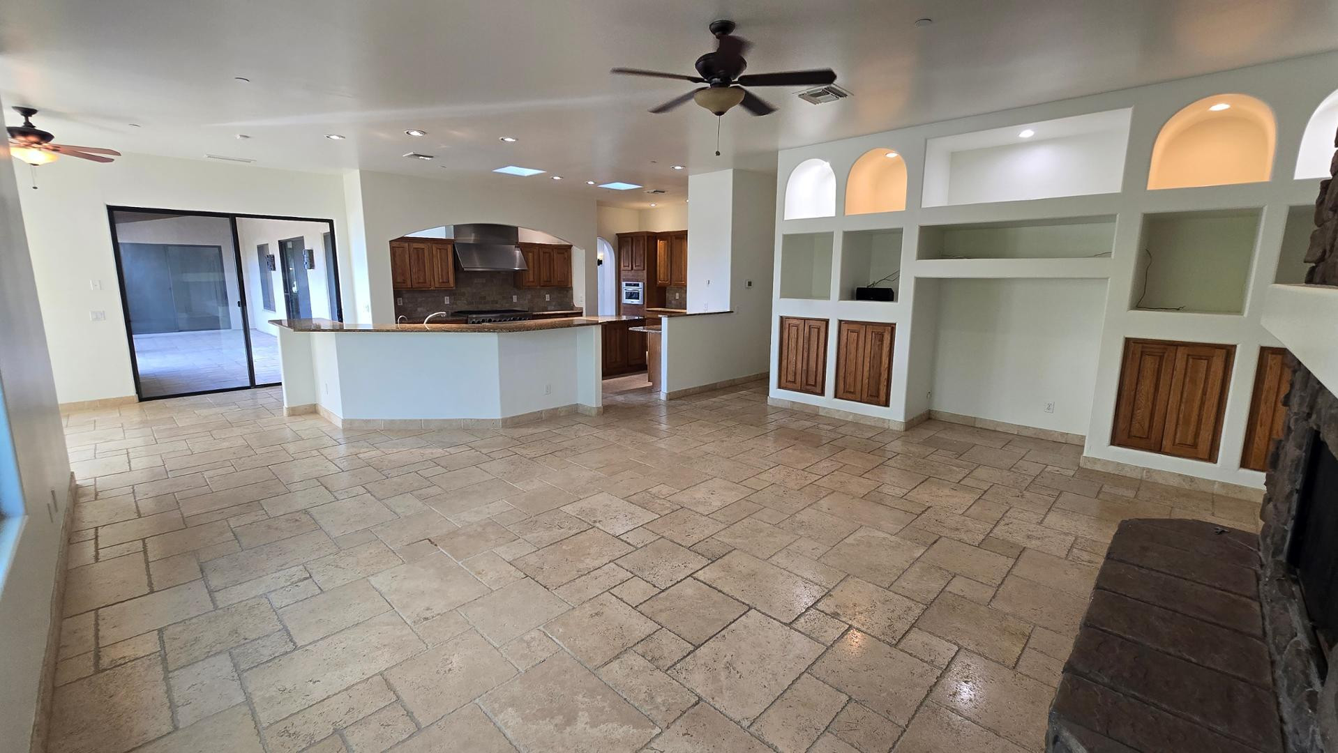 4485 East Quail Brush Road Cave Creek, AZ 85331 - Photo 18 of 64 a view of a kitchen with a sink and a living room area