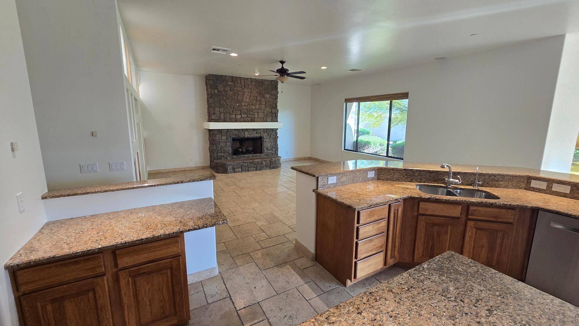 4485 East Quail Brush Road Cave Creek, AZ 85331 - Photo 22 of 64 a kitchen with a stove and cabinets