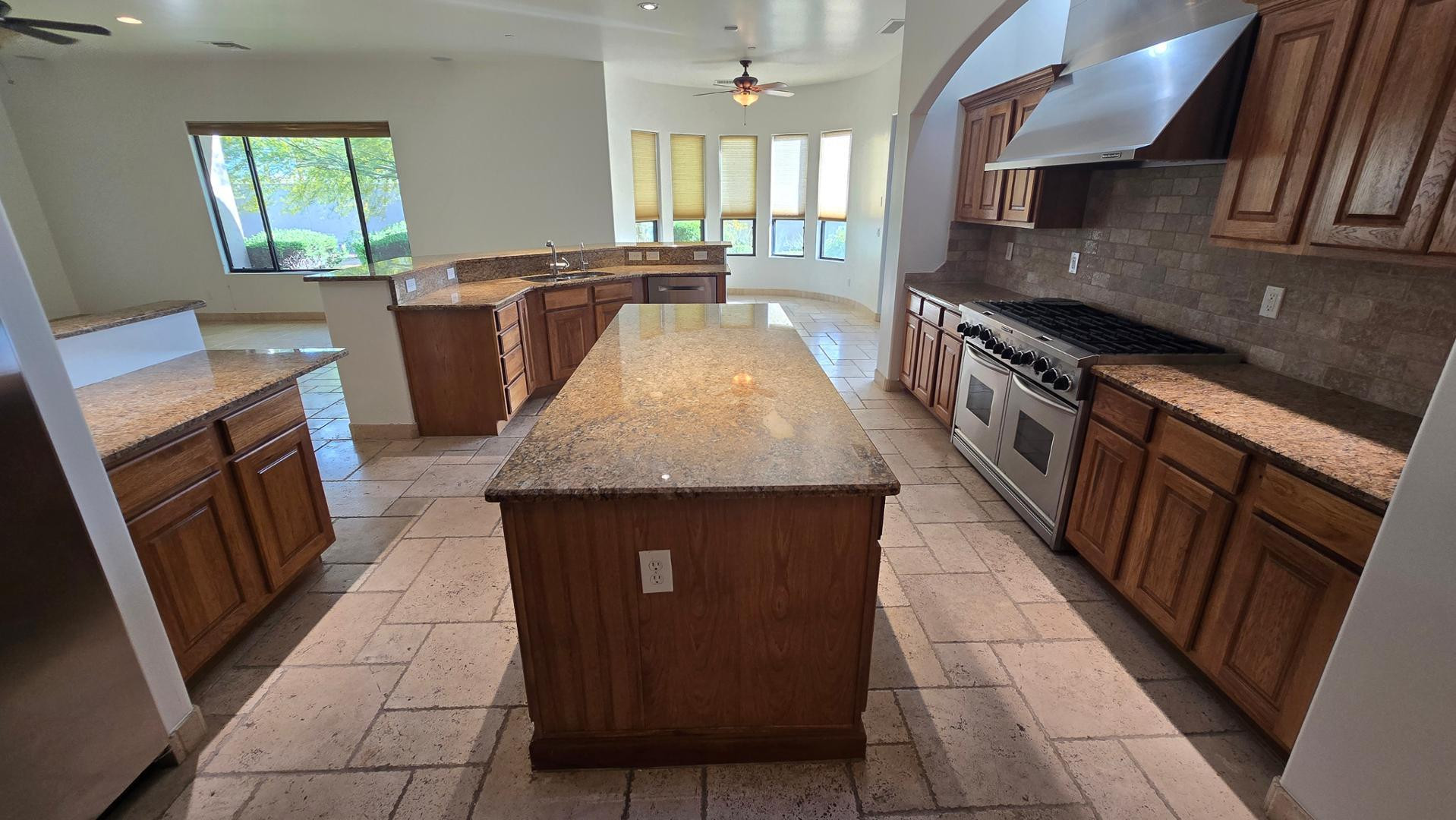4485 East Quail Brush Road Cave Creek, AZ 85331 - Photo 23 of 64 a kitchen with sink cabinets and stove