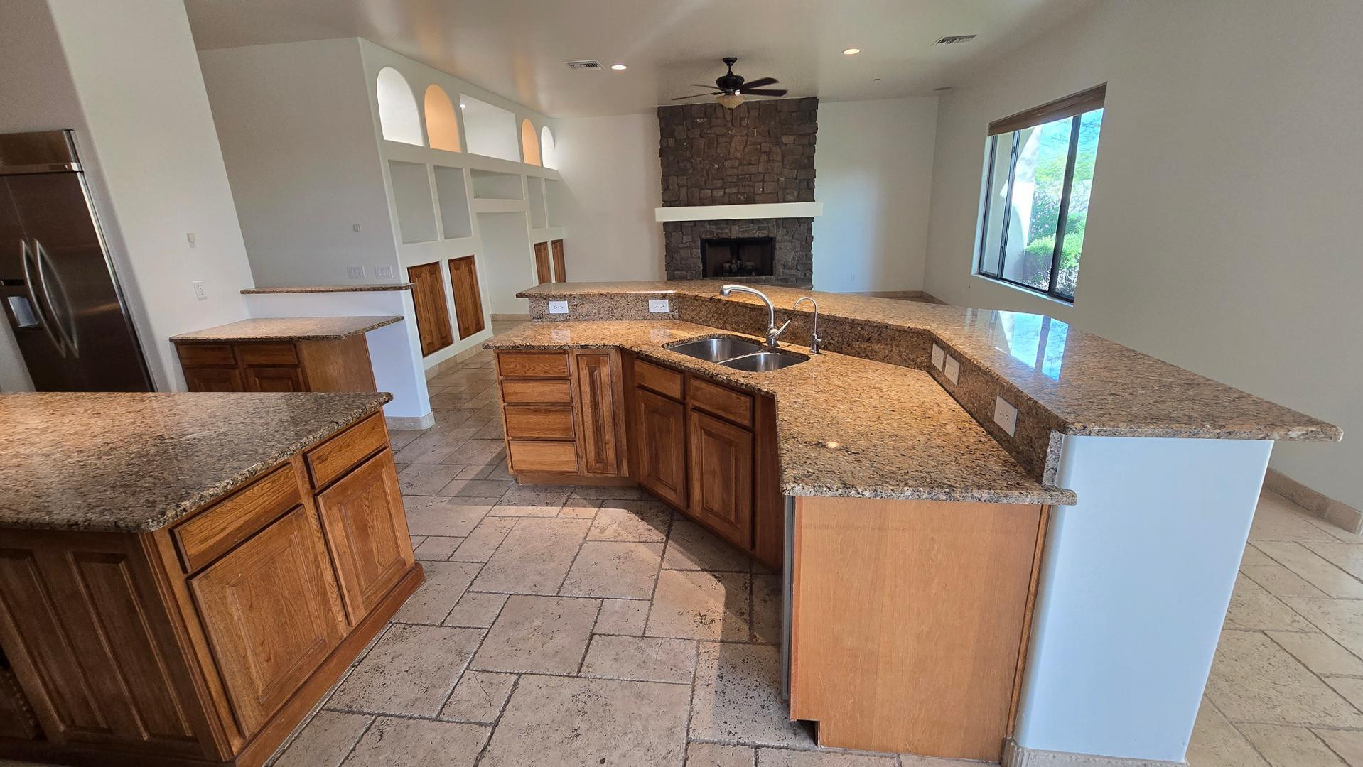4485 East Quail Brush Road Cave Creek, AZ 85331 - Photo 24 of 64 a kitchen with a stove top oven and sink