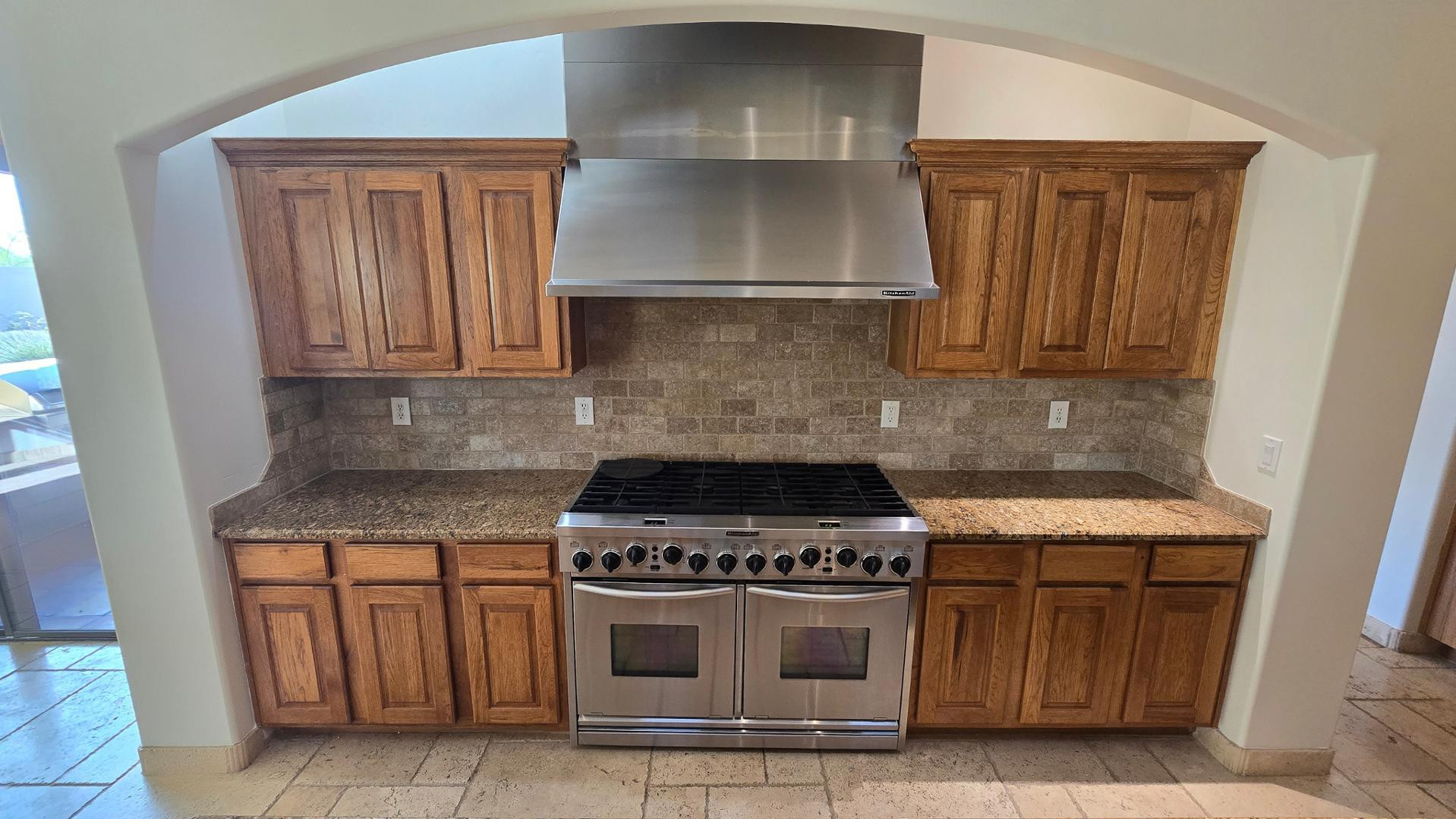 4485 East Quail Brush Road Cave Creek, AZ 85331 - Photo 27 of 64 a kitchen with granite countertop a stove and a sink