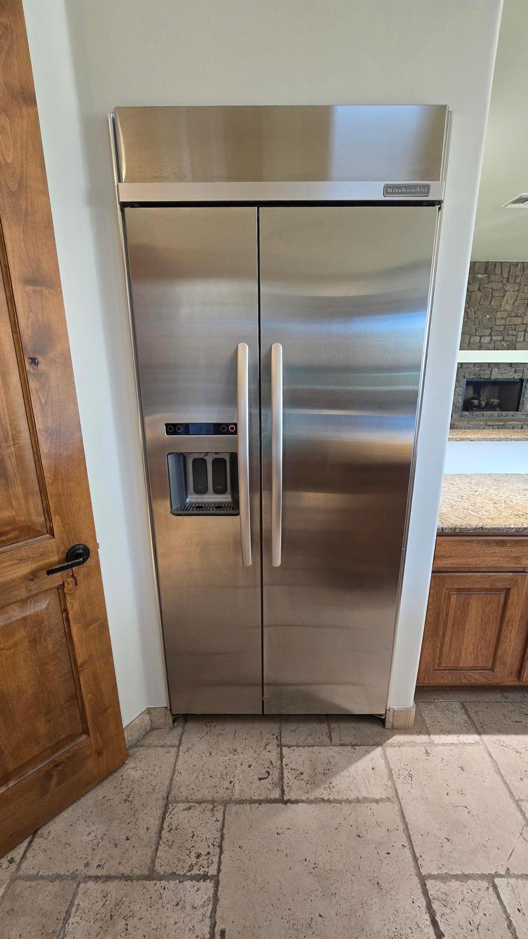 4485 East Quail Brush Road Cave Creek, AZ 85331 - Photo 29 of 64 a refrigerator freezer sitting inside of a kitchen
