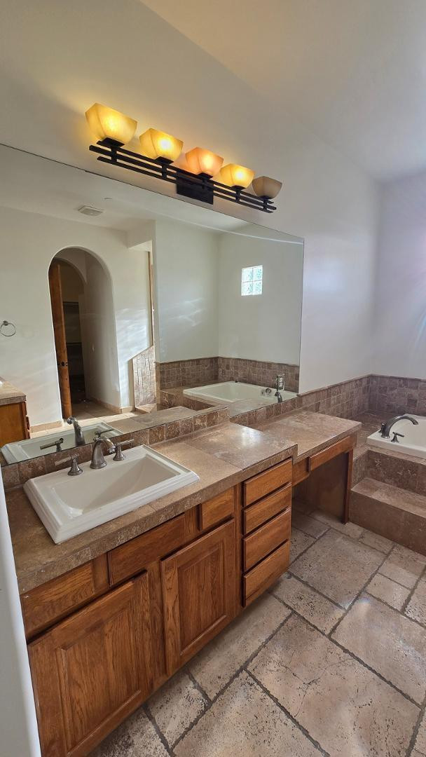 4485 East Quail Brush Road Cave Creek, AZ 85331 - Photo 33 of 64 a bathroom with a double vanity sink and a mirror