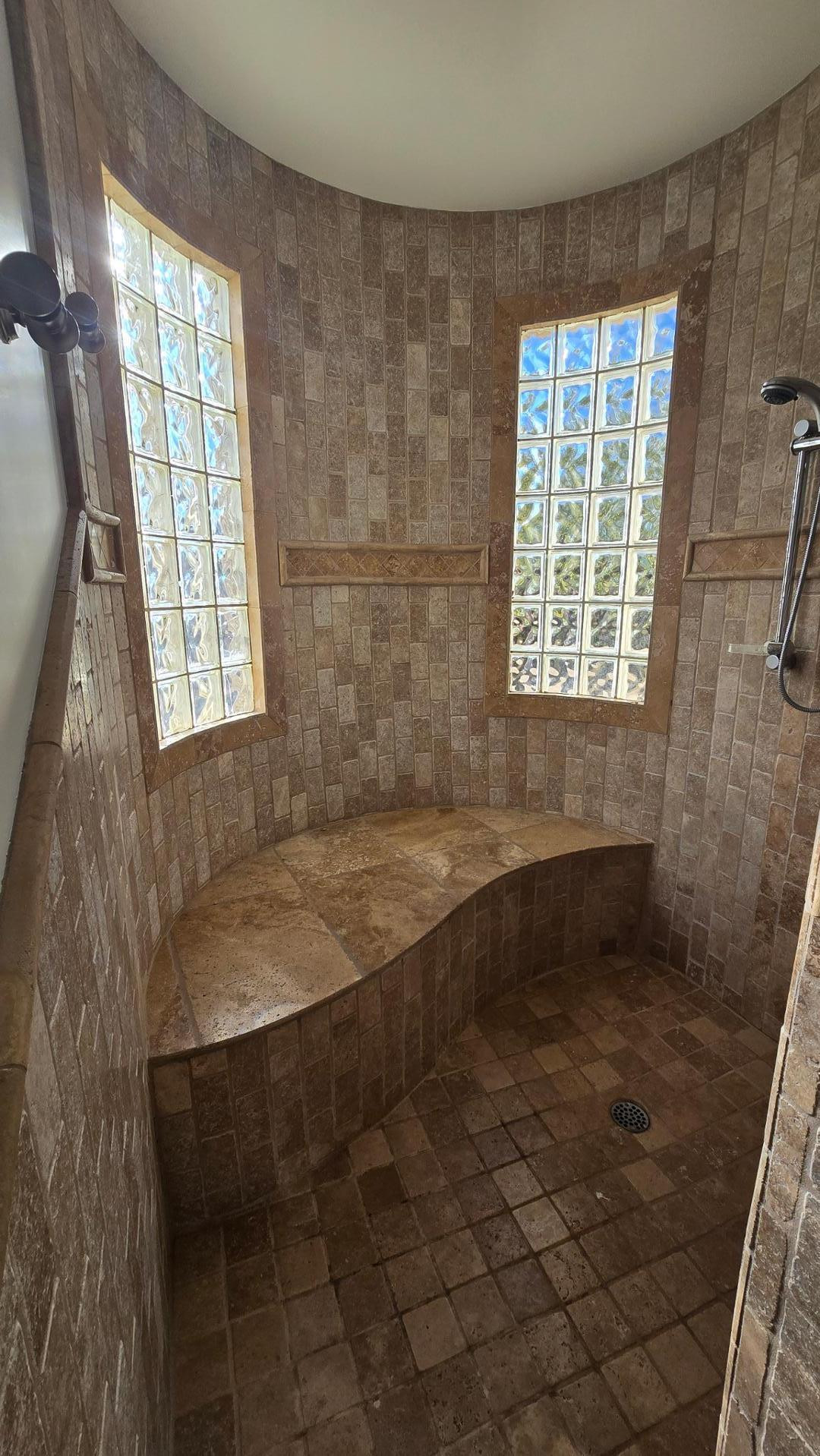 4485 East Quail Brush Road Cave Creek, AZ 85331 - Photo 37 of 64 a bathroom with a bathtub and window