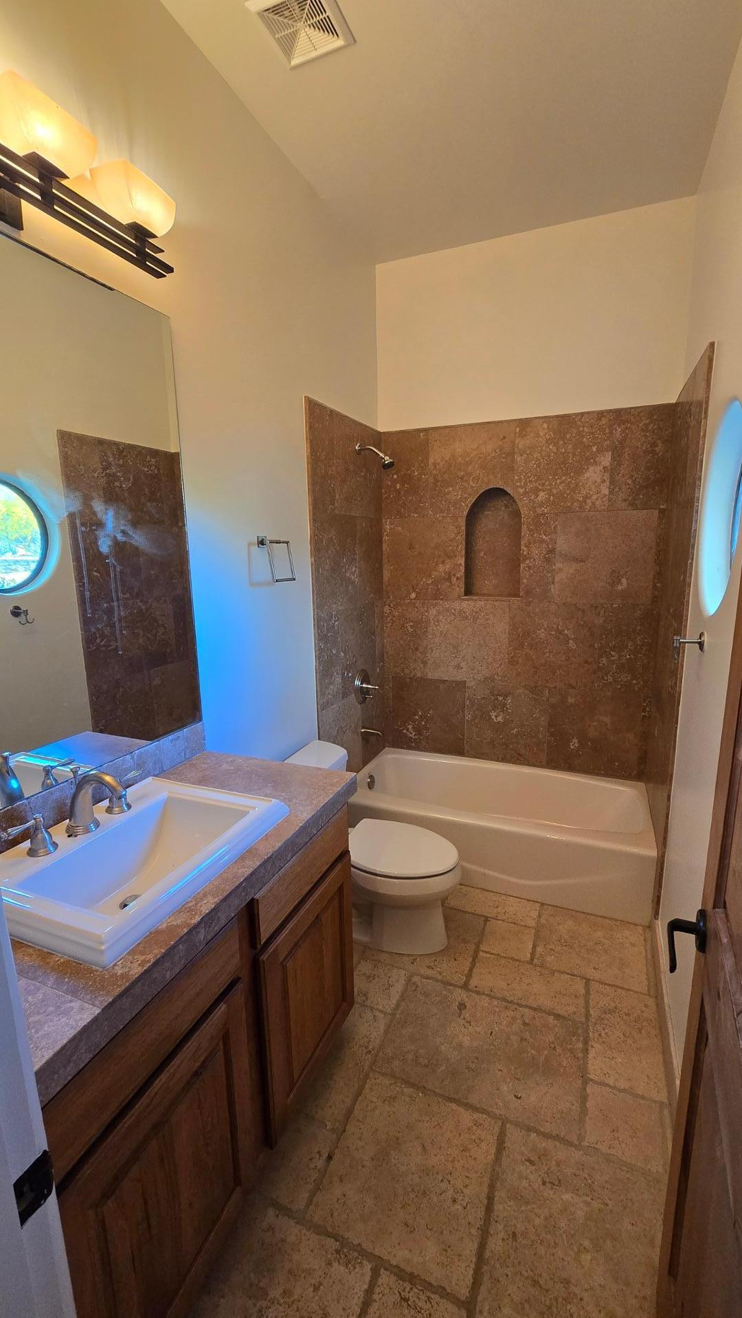 4485 East Quail Brush Road Cave Creek, AZ 85331 - Photo 39 of 64 a bathroom with a sink a toilet and shower