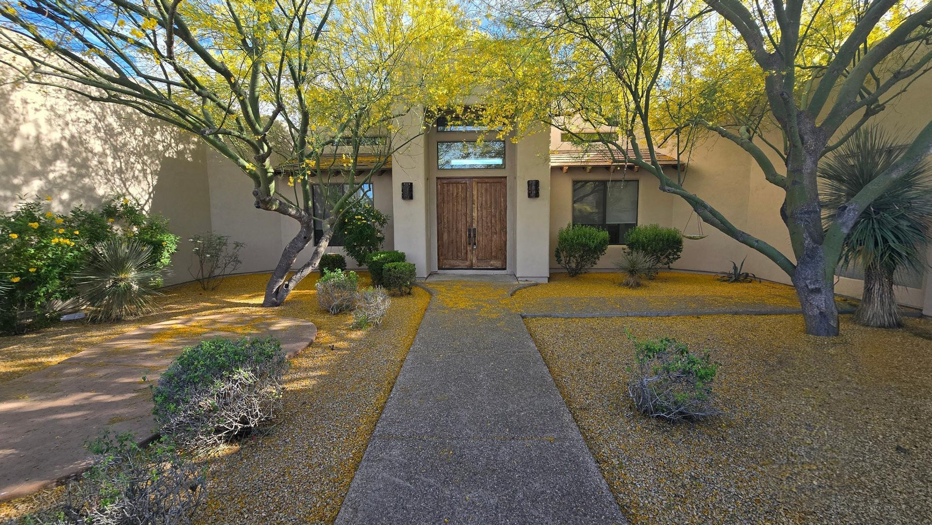 4485 East Quail Brush Road Cave Creek, AZ 85331 - Photo 4 of 64 a front view of a house with a yard and garage