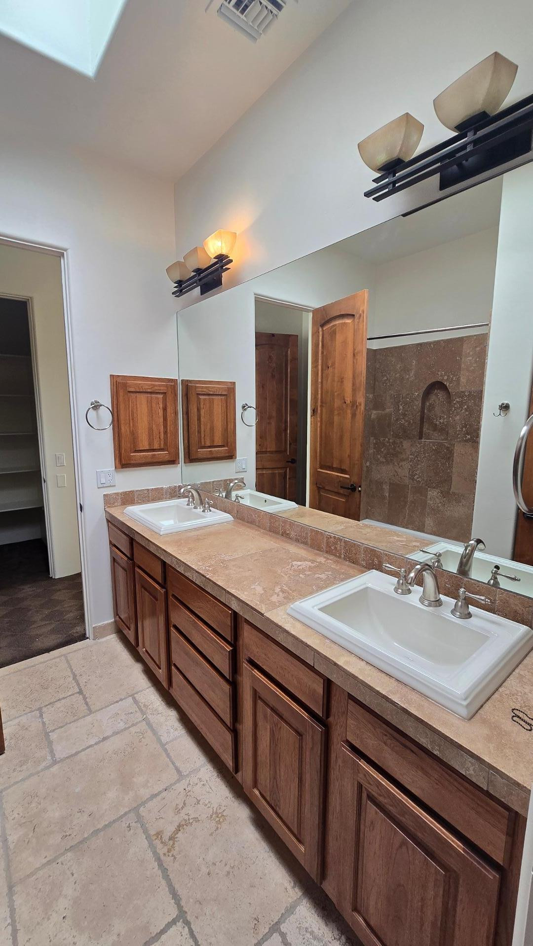4485 East Quail Brush Road Cave Creek, AZ 85331 - Photo 41 of 64 a bathroom with a sink and a mirror