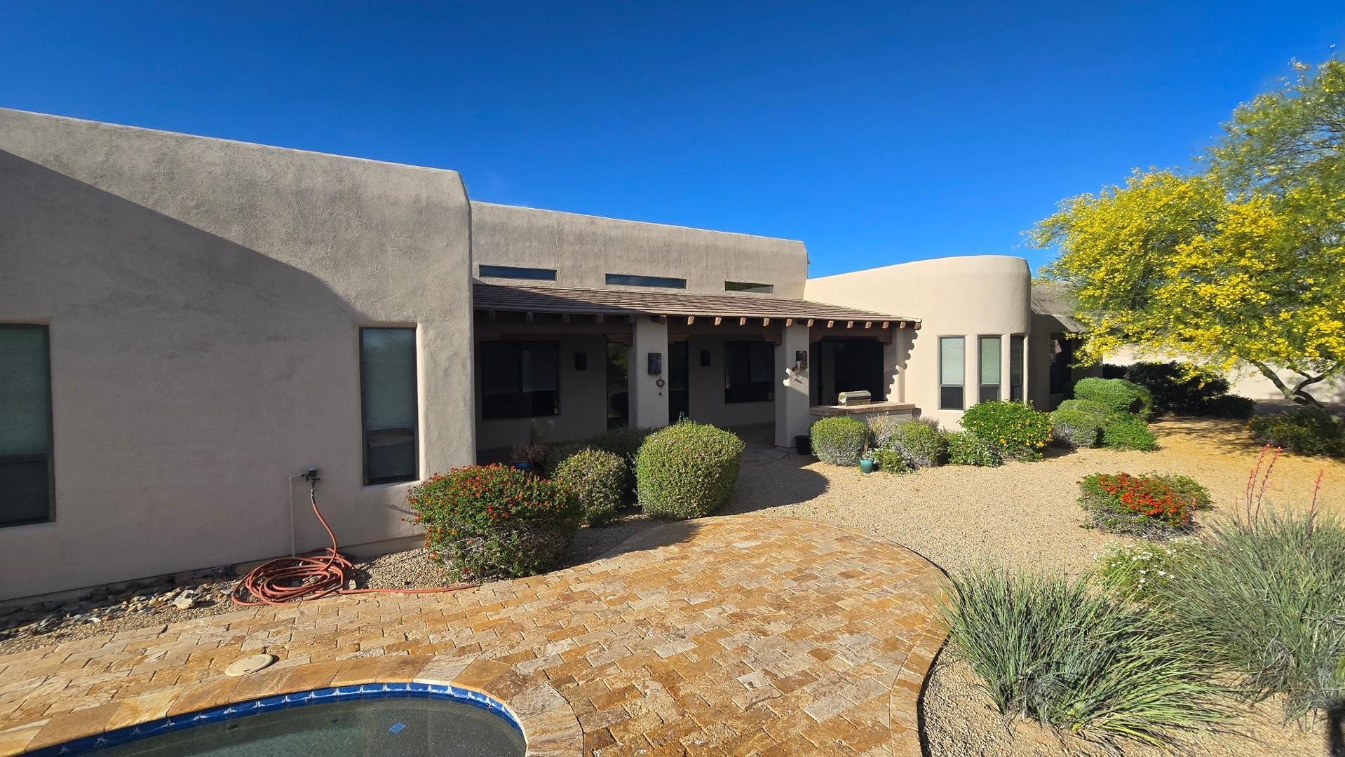 4485 East Quail Brush Road Cave Creek, AZ 85331 - Photo 48 of 64 a front view of a house with a yard