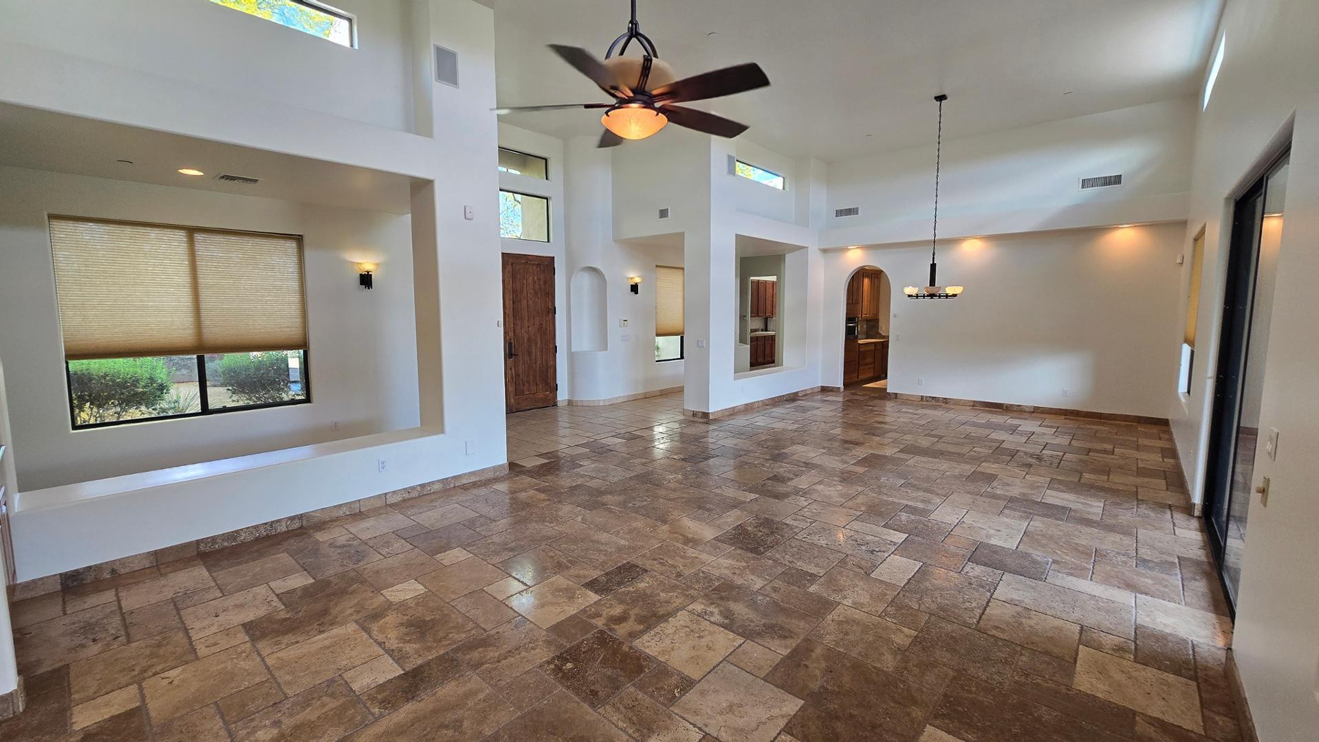 4485 East Quail Brush Road Cave Creek, AZ 85331 - Photo 8 of 64 a view of a livingroom with a ceiling fan and window