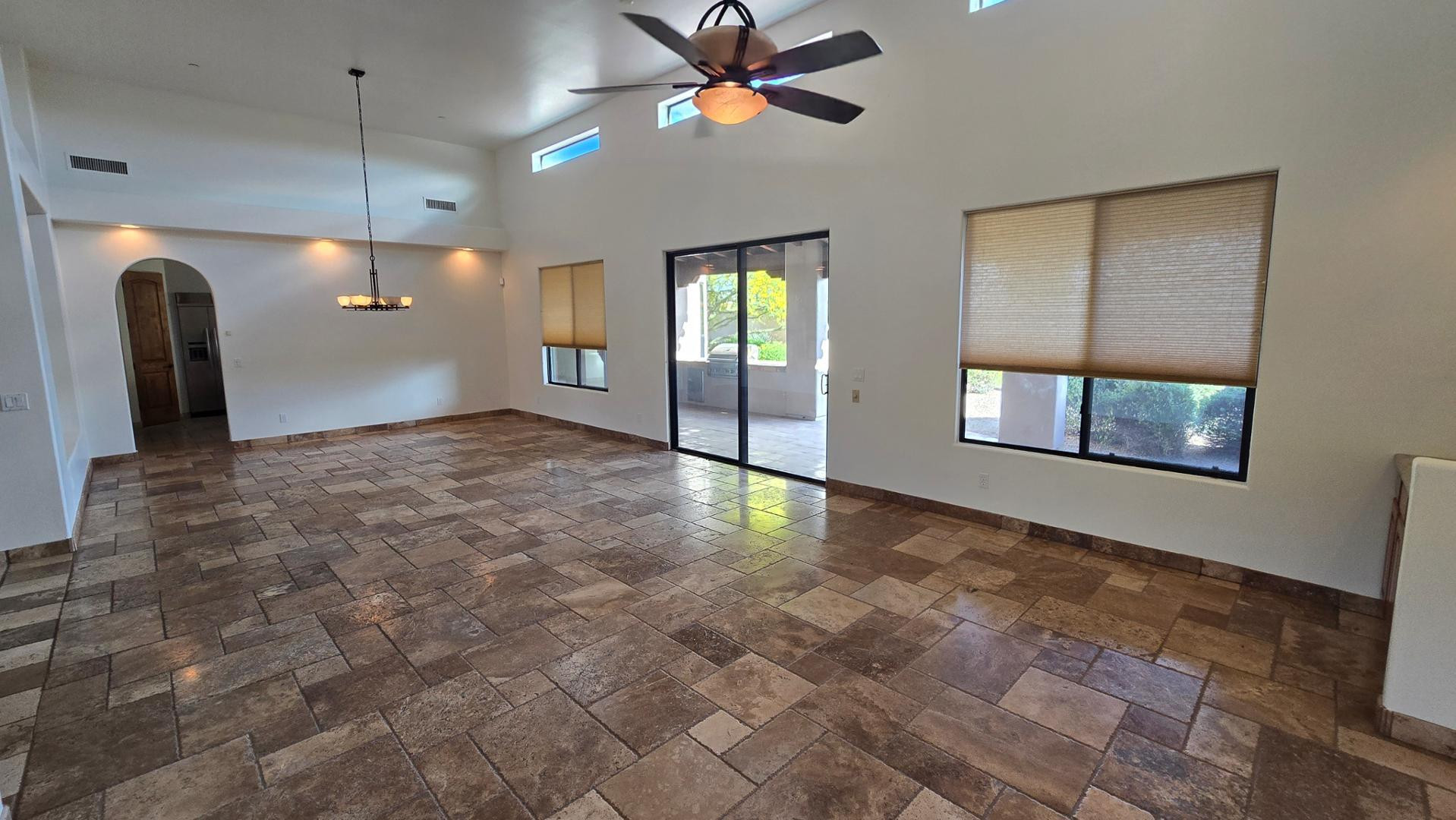 4485 East Quail Brush Road Cave Creek, AZ 85331 - Photo 9 of 64 a view of an empty room with window and cabinet