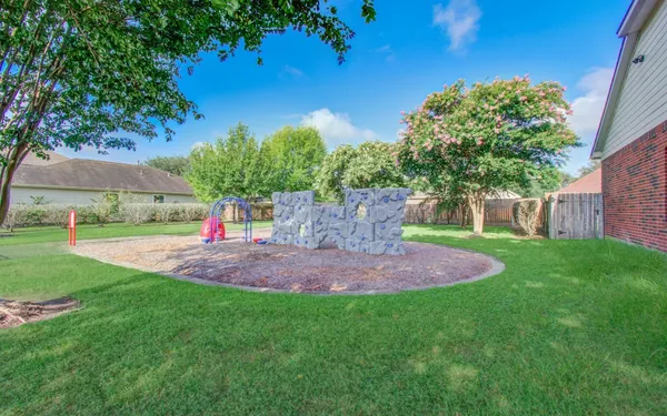 a view of yard with swimming pool